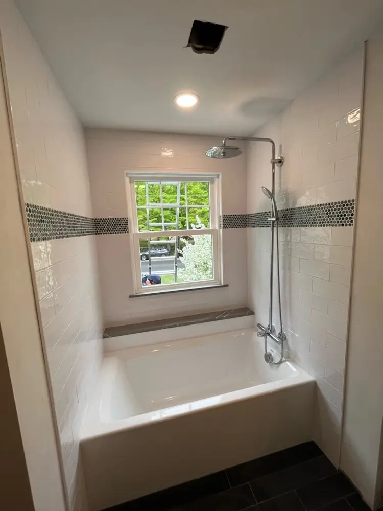 Newly remodeled bathroom soaking with tiled shower