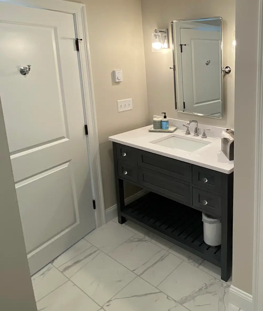 Newly remodeled bathroom interior vanity with marble floor