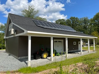 Garage addition with solar panels and landscaping